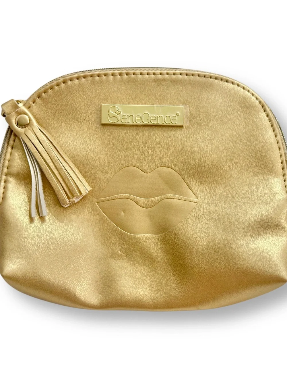 SeneGence Gold Cosmetic Pouch with Tassel and Lip Embossed, New Without Tags